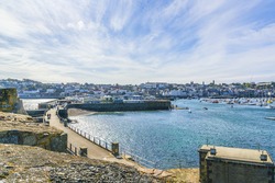 Castle Cornet has guarded Saint Peter Port and harbor for 800 years. Saint Peter Port - capital of Guernsey - British Crown dependency in English Channel off the coast of Normandy.