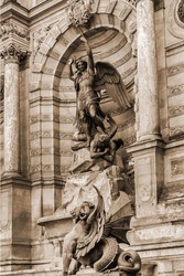 Detail of ancient Paris Fountain Saint-Michel at Place Saint-Michel. France. Fountain Saint-Michel constructed in 1858 - 1860 during French Second Empire. Vintage, sepia. Paris, France.