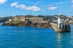 Castle Cornet has guarded Saint Peter Port for 800 years. Saint Peter Port - capital of Guernsey - British Crown dependency in English Channel off the coast of Normandy.