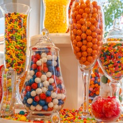 Confectionery Sweet Shop Candies displayed in glass jars and vases.  Square.