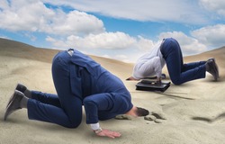 The businessman hiding his head in sand escaping from problems