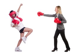 Beautiful businesswomen boxing isolated on white
