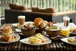 Western big gourmet breakfast selection mixed dishes on french restaurant table