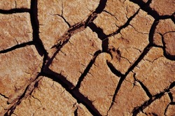 Close-up of drought cracked land, top-view