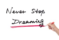 Never stop dreaming words written on white board