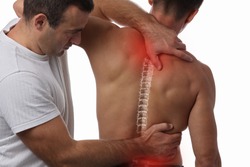 Man having chiropractic back adjustment. Osteopathy, Physiotherapy, sport injury rehabilitation concept