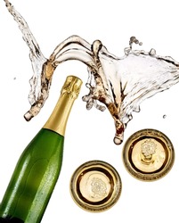 Champagne bottle and two glasses splash, top view