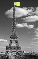 flag like a jackets symbol of Yellow vests movement on Eiffel Tower in Paris seen from the Trocadero in black and White effect