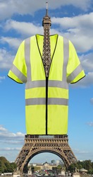 Very Big Yellow jacket symbol of Yellow vests movement on Eiffel Tower in Paris France. This is a photomontage. Not Really
