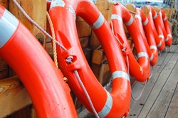 row of life buoys on boat