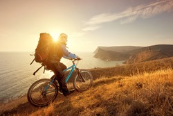 cyclist on a mountain bike travels around the beautiful landscape