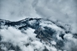 Clouds over the stone mountain. Landscape in the Andes, Peru.