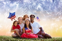 American family celebrating Independence Day. Picnic and fireworks on 4th of July in America. USA flag. Parents and kids celebrate US holiday. Children watching firework.