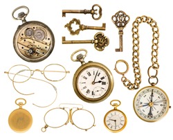 set of golden vintage collectible accessories. antique keys, clock, compass, glasses isolated on white background