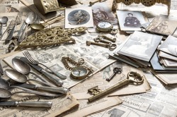 Antique rarity goods, private collection. Old cutlery, clock, key, photos. Collectibles. Shabby chic. Selective focus