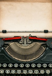 Antique typewriter with aged textured paper sheet. Space for your text