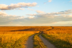 Gravel pathway on Wah'Kon-Tah Prairie towards sunset