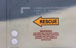 Rescue warning sign on fuselage of modern jet fighter.