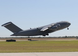 US Air Force military cargo airplane taking off