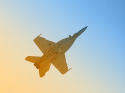Modern US Navy fighter jet in morning sunshine