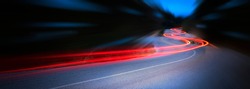Panoramic - Cars light trails at night in a curve  asphalt road at night, long exposure image