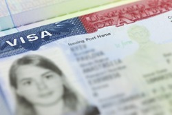 The American Visa in a passport page (USA) background - selective focus