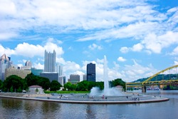 Pittsburgh's Point State Park fountain with the skyline rising up behind it.