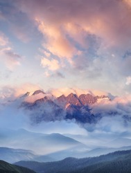 Mountain range in the clouds. Beautiful natural landscape