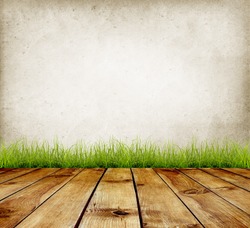 Old wall and green grass on wood floor background