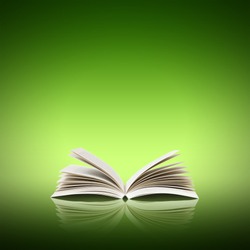 Open book isolated on green background