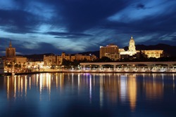 City of Malaga illuminated at dusk. Andalusia, Spain