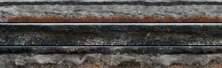 Layered asphalt road side texture with soil geology cross section underground earth, cutaway tar road  terrain surface