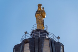 Gold Statue of Holy Mary on the top of Sanctuary of 