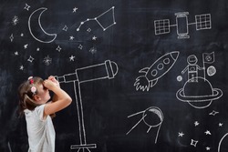 Schoolgirl standing in front of a blackboard, watching stars through a chalk-drawn telescope, learning about space and astronomy