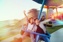 Beautiful, young couple having fun at an amusement park