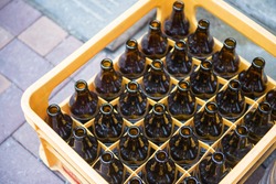 beer bottle in yellow plastic crates, glass