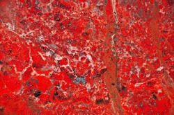 Amazing natural textures of slice of red and white jasper mineral for background. Natural stone surfaces, backgrounds and wallpapers. Colored semi-precious stones. Beautiful color spots
