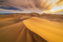 Sunset over the sand dunes in the desert. Death Valley, USA