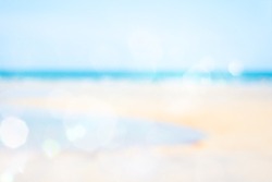 Blurred cool sea and sunlight with tropical sandy beach on background 