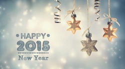 Happy New Year 2015 text with hanging star ornaments