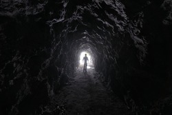Man explores a cave