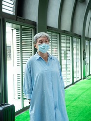 Portrait of senior asian woman 60s wearing facemask during covid19 and flu outbreak.