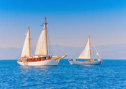 2 Old classic wooden sailing boats  during a Classic Boats Regatta in Spetses island in Greece
