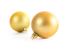 Two beautiful christmas gold balls isolated on white background
