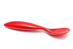 Red plastic spoons on white