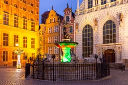 Long Market Street with Fountain of Neptune at night in Old Town of Gdansk, Poland