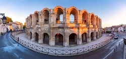 Panorama of roman Roman Amphitheatre and arena at sunrise, Arles, Provence, southern France