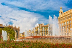 Beautiful fountain at Plaza Catalunya or Catalonia Square in Barcelona at sunny summer day, Catalonia, Spain