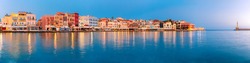 Picturesque panoramic view of old harbour with Lighthouse of Chania at sunrise, Crete, Greece.