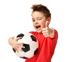 Fan sport boy player hold soccer ball in red t-shirt celebrating happy smiling laughing show thumbs up success sign free text copy space isolated on white background